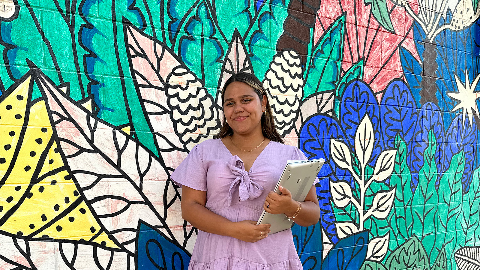Northern Territory Government Trainee holding laptop